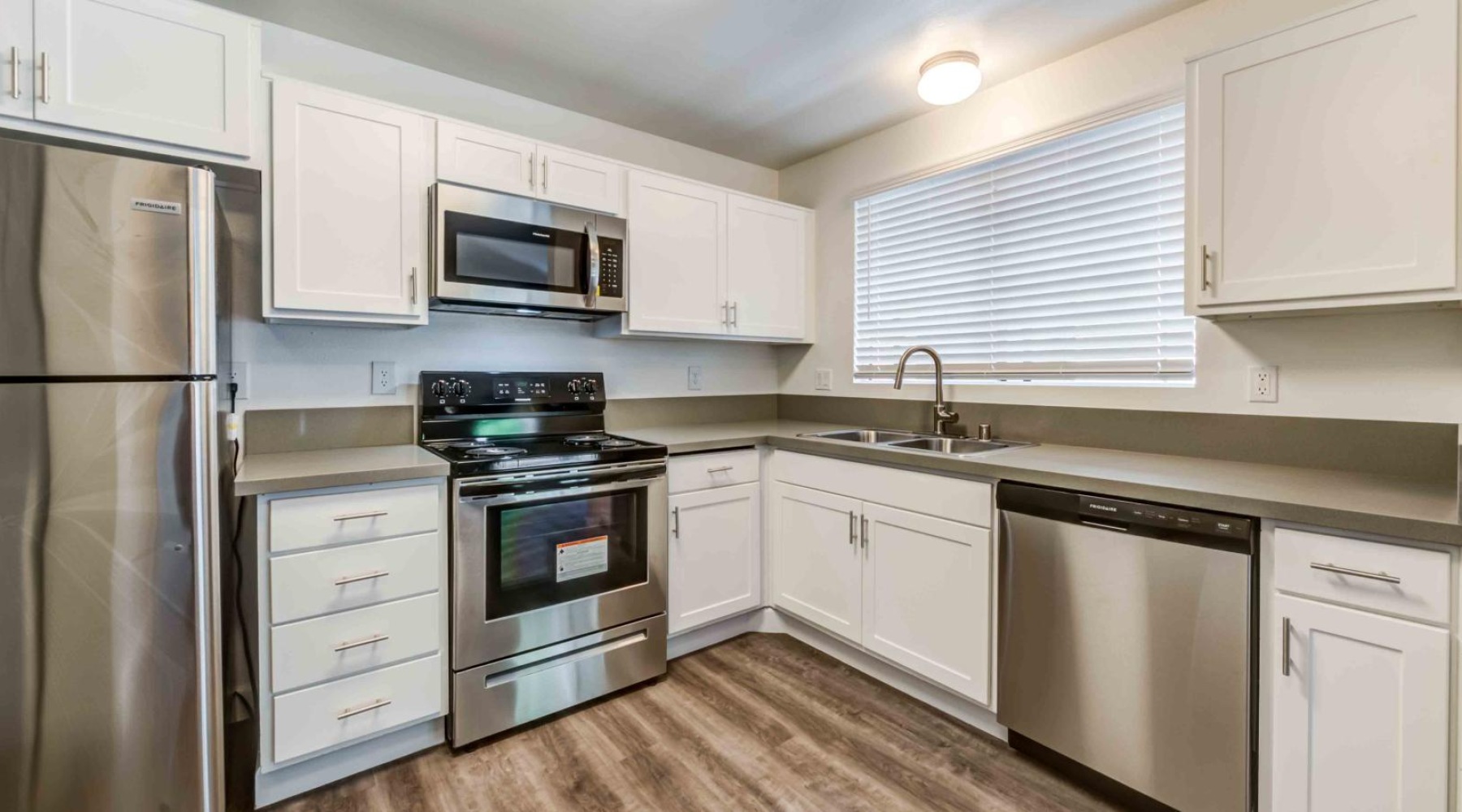 a kitchen with white cabinets