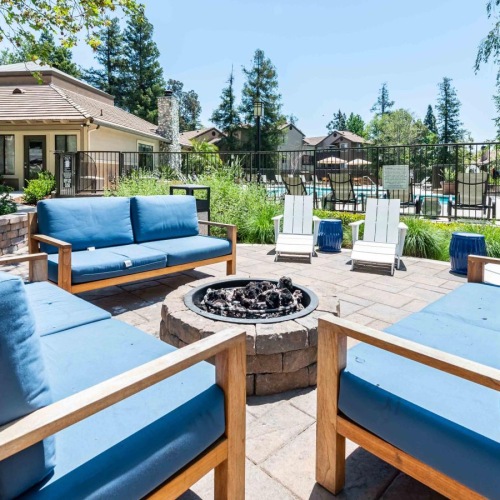 Take advantage of all Creekside Alta Loma has to offer a deck with chairs and a fire pit on it