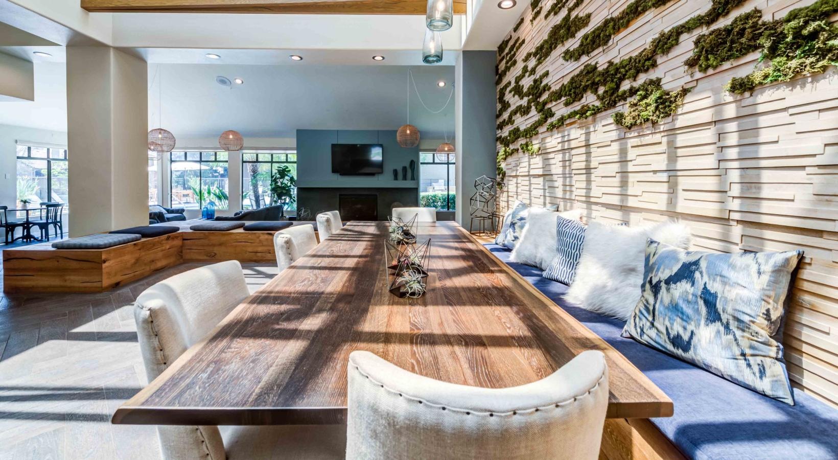 Take advantage of all Creekside Alta Loma has to offer clubroom lounge area with long wooden table