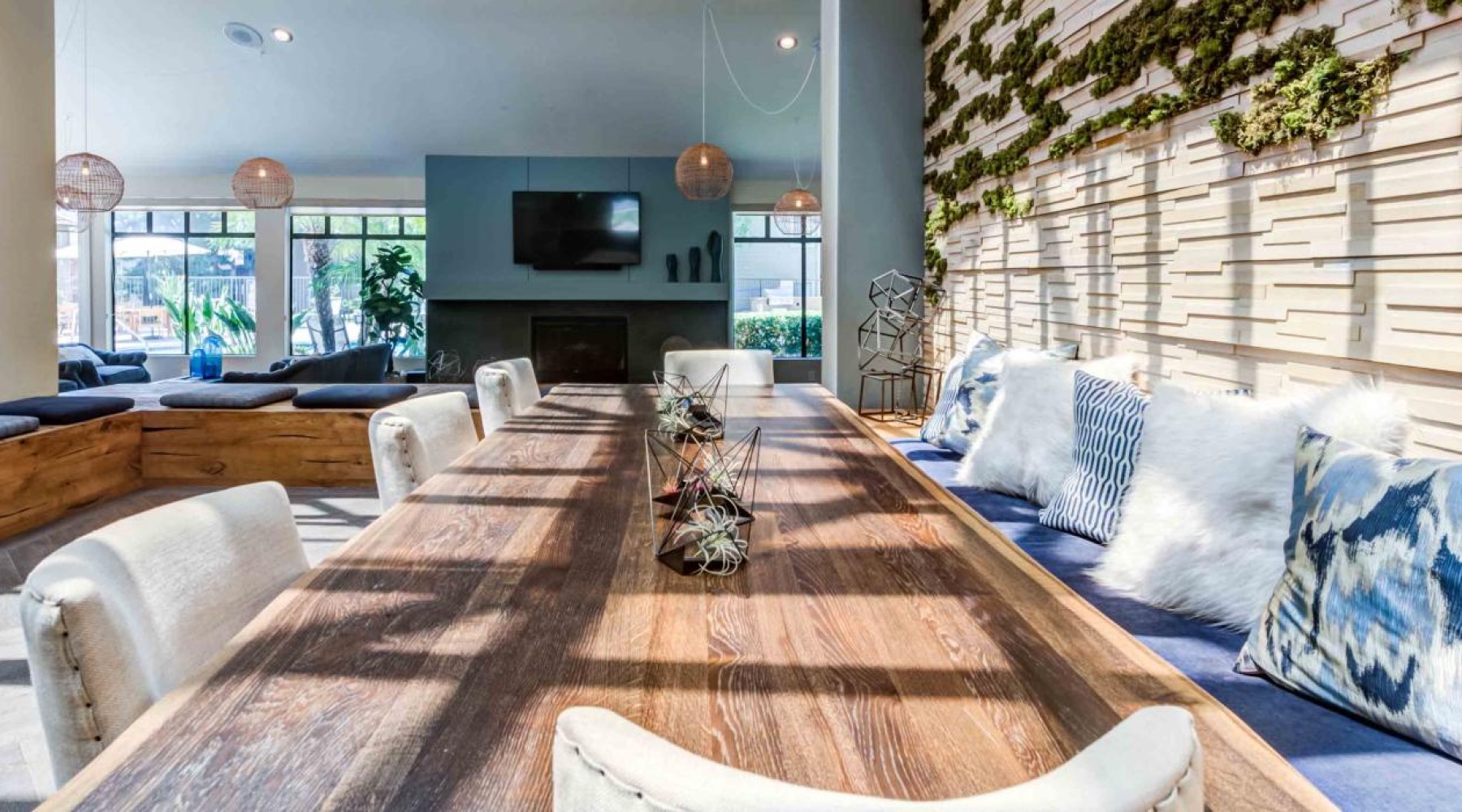 clubroom lounge area with long wooden table 